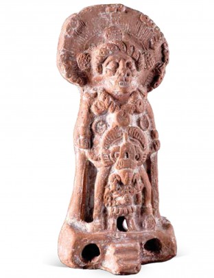 Figurilla con la efigie de una deidad con cabeza zoomorfa, sobre una litera real