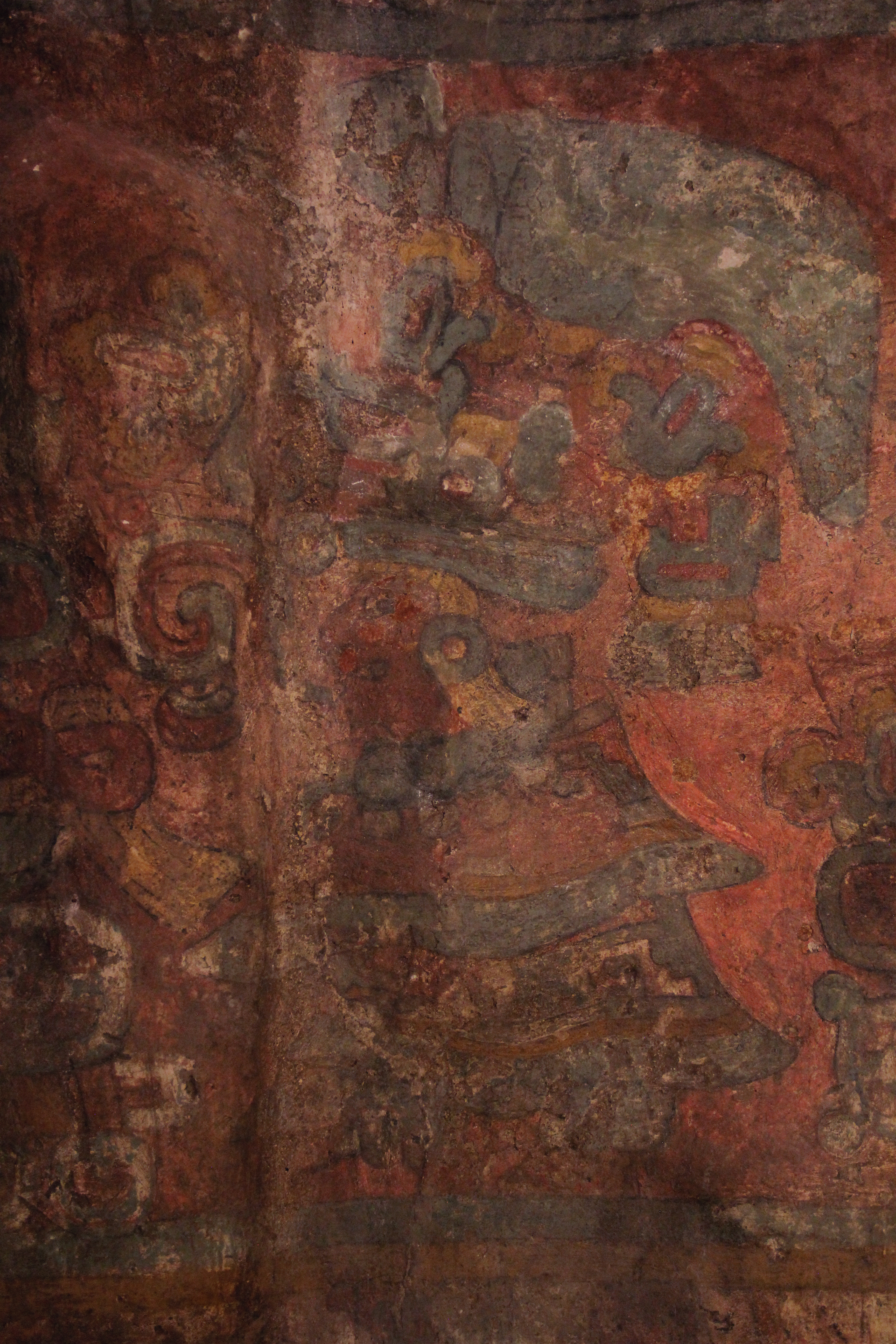 Female figure wearing a quexquémetl decorated with stepped meander patterns and alternating strips of red and yellow